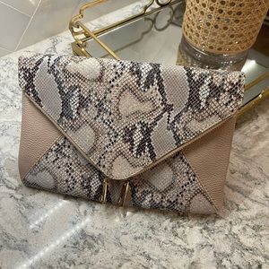 Beautiful nude and snake clutch